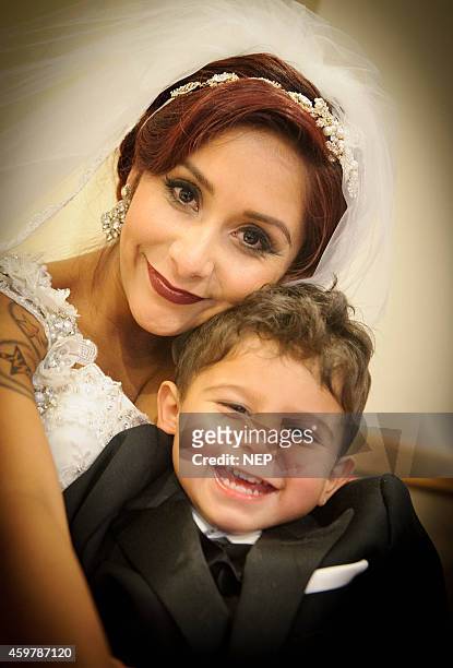 Nicole "Snooki" Polizzi and son Lorezo LaValle attend the wedding of Nicole "Snooki"Polissi and Jionni Lavalle at St. Rose Of Lima on November 29,...