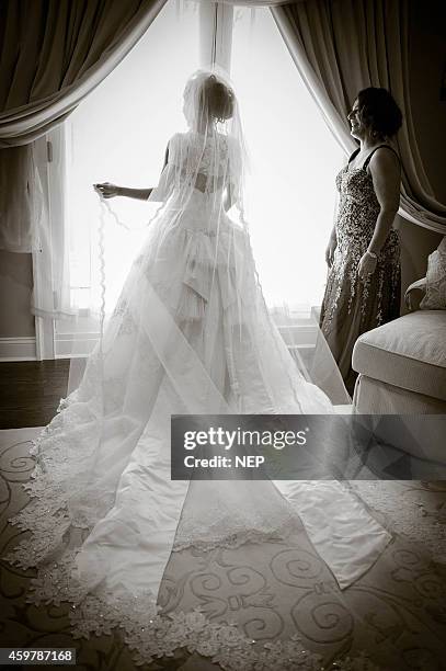 Nicole "Snooki" Polizzi is seen during her wedding to Jionni Lavalle at St. Rose Of Lima on November 29, 2014 in East Hanover, New Jersey. Dress by...