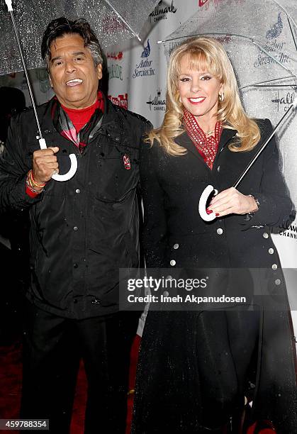 Hosts Erik Estrada and Laura McKenzie attend the 83rd Annual Hollywood Christmas Parade with musical performances by Grand Marshal Stevie Wonder and...