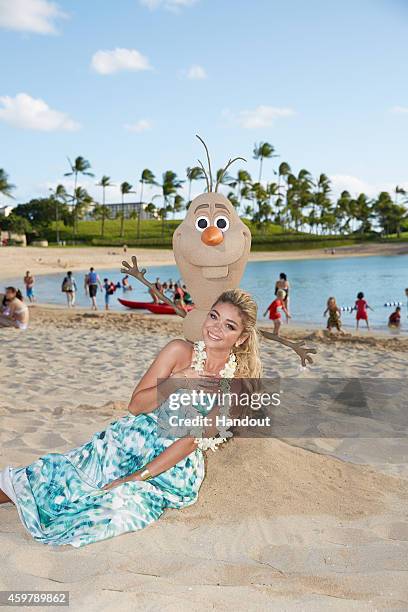 In this handout photo provided by Disney Parks, 'Modern Family' star Sarah Hyland is photographed on the beach at at Aulani, a Disney Resort & Spa,...