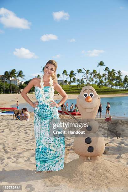 In this handout photo provided by Disney Parks, 'Modern Family' star Sarah Hyland is photographed on the beach at at Aulani, a Disney Resort & Spa,...