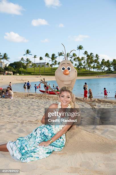 In this handout photo provided by Disney Parks, 'Modern Family' star Sarah Hyland is photographed on the beach at at Aulani, a Disney Resort & Spa,...