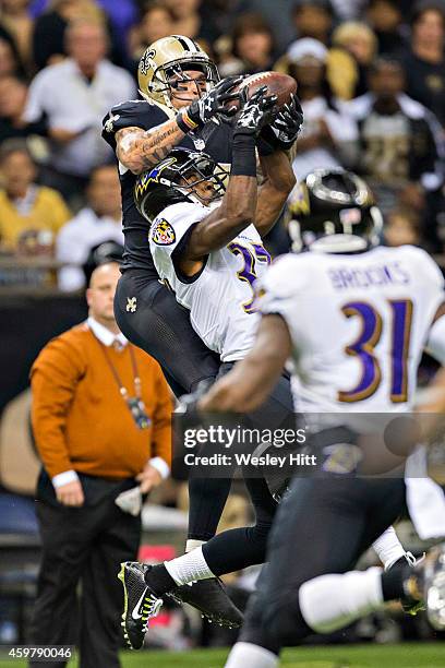 Kenny Stills of the New Orleans Saints goes to catch a pass in the third quarter over Danny Gorrer of the Baltimore Ravens at Mercedes-Benz Superdome...