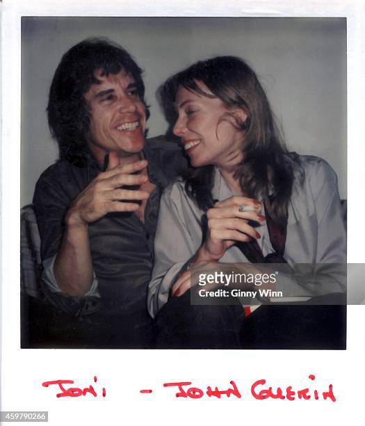 Singer and songwriter Joni Mitchell and drummer, percussionist and session musician John Guerin in a Los Angeles studio, California, circa 1976. .