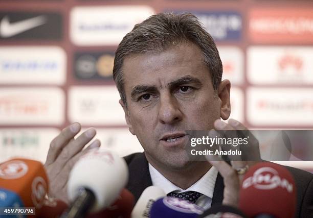 Hamza Hamzaoglu delivers a speech during a press conference after he and Galatasaray SK signed for the new football coaching of the Galatasaray...