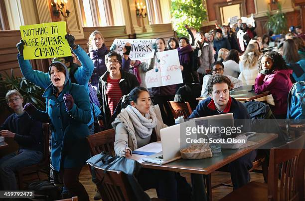 Students at Washington University march through a student lounge during a protest to draw attention to police abuse on December 1, 2014 in St. Louis,...