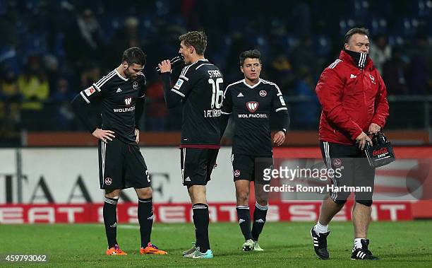 Ondrej Celustka, Niclas Stark and Alessandro Schoepf of Nuernberg look dejected after the 2. Bundesliga match between Eintracht Braunschweig and 1....