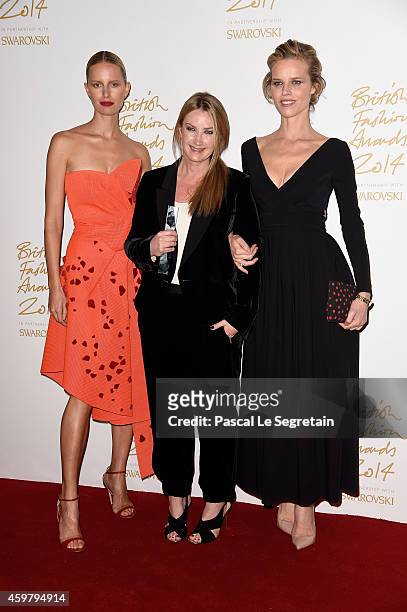 Accessory designer Anya Hindmarch poses with Karolina Kurkova and Eva Herzigova in the winners room at the British Fashion Awards at London Coliseum...