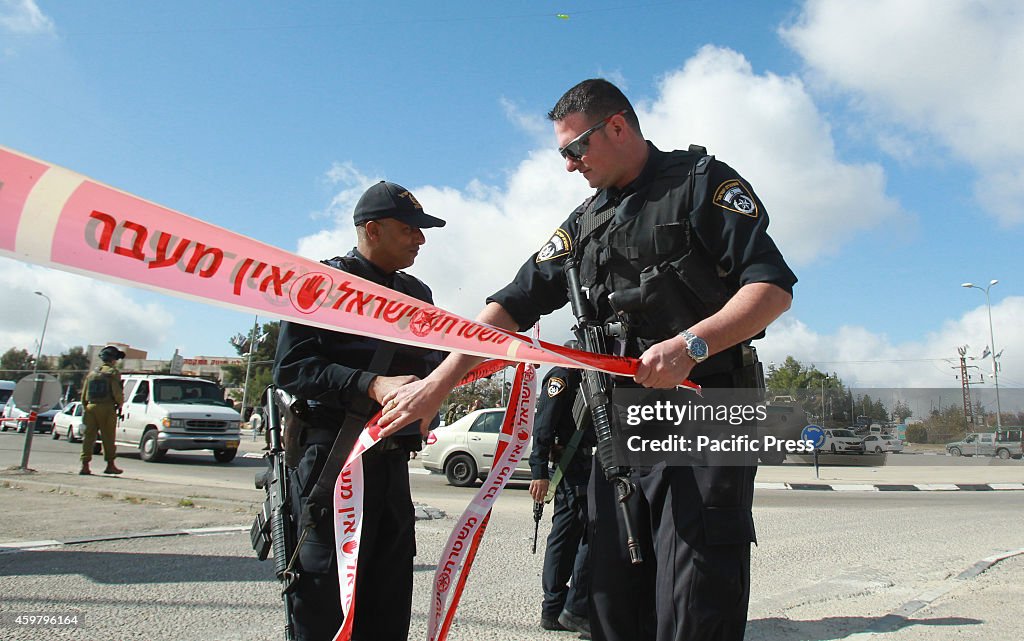 Israeli police carry out forensic work at the site of an...