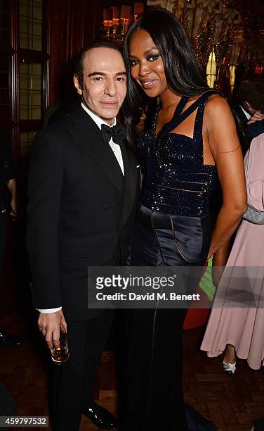 John Galliano and Naomi Campbell attend a party in celebration of Edward Enninful in The Oscar Wilde Bar, Hotel Cafe Royal, on December 1, 2014 in...