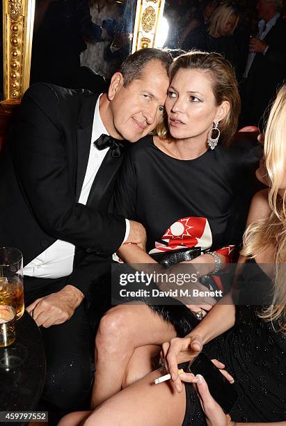 Mario Testino and Kate Moss attend a party in celebration of Edward Enninful in The Oscar Wilde Bar, Hotel Cafe Royal, on December 1, 2014 in London,...