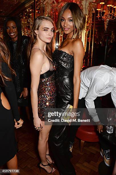 Cara Delevingne and Jourdan Dunn attend a party in celebration of Edward Enninful in The Oscar Wilde Bar, Hotel Cafe Royal, on December 1, 2014 in...