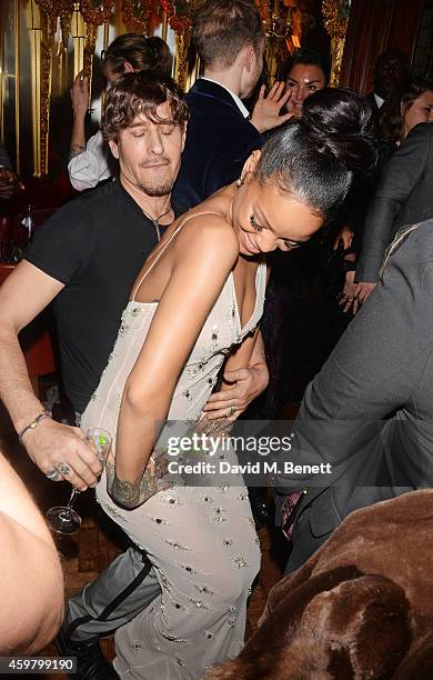 Rihanna and Steven Klein dance at a party in celebration of Edward Enninful in The Oscar Wilde Bar, Hotel Cafe Royal, on December 1, 2014 in London,...