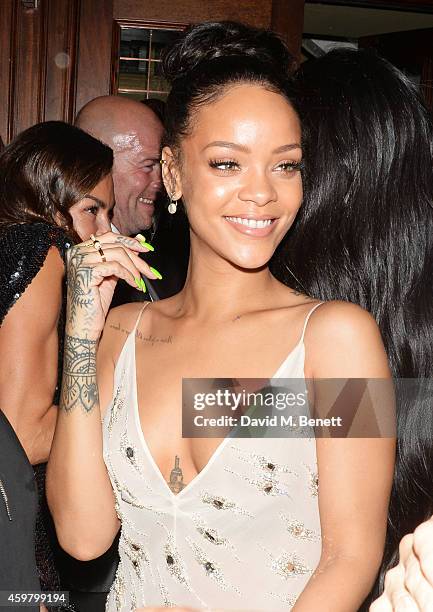 Rihanna attends a party in celebration of Edward Enninful in The Oscar Wilde Bar, Hotel Cafe Royal, on December 1, 2014 in London, England.