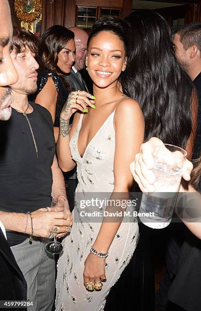 Rihanna attends a party in celebration of Edward Enninful in The Oscar Wilde Bar, Hotel Cafe Royal, on December 1, 2014 in London, England.