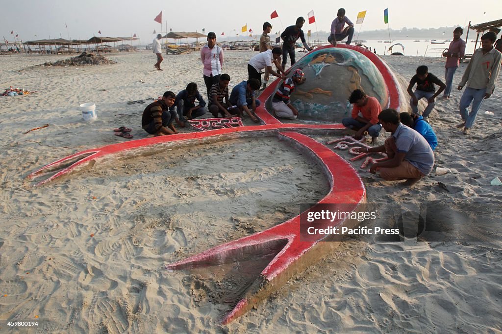 Students make sand sculpture for the " World AIDS Awareness...