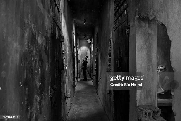 Vietnamese visitor to the notorious Hoa Lo Prison in Hanoi, now a museum, , euphemistically called the "Hanoi Hilton" during Vietnam War by US POWs,...
