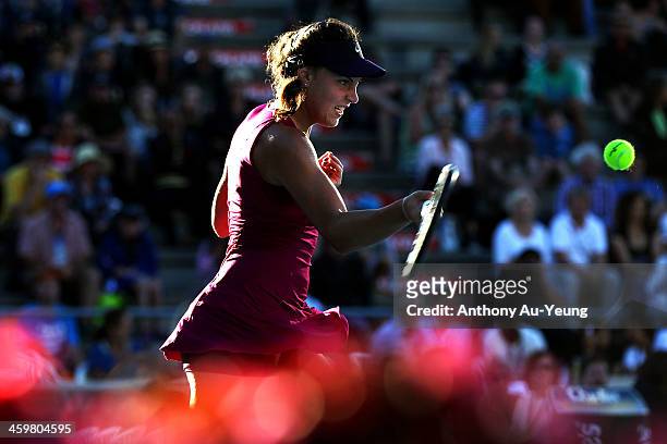 Ana Konjuh of Croatia plays a forehand against Roberta Vinci of Italy during day two of the ASB Classic at ASB Tennis Centre on December 31, 2013 in...