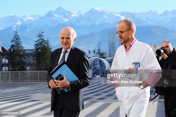 Surgeon and Michael Schumacher's friend professor Gerard Saillant and Professor Jean-Francois Payen leave a press conference at Grenoble University...