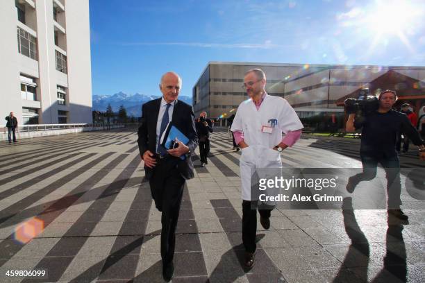 Surgeon and Michael Schumacher's friend professor Gerard Saillant and Professor Jean-Francois Payen leave a press conference at Grenoble University...
