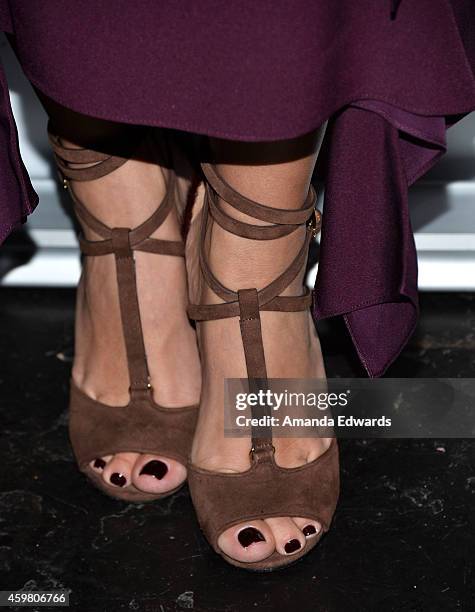 Television personality Kim Kardashian raises a toast for the Elizabeth Taylor Foundation/World AIDS Day at The Abbey on December 1, 2014 in West...