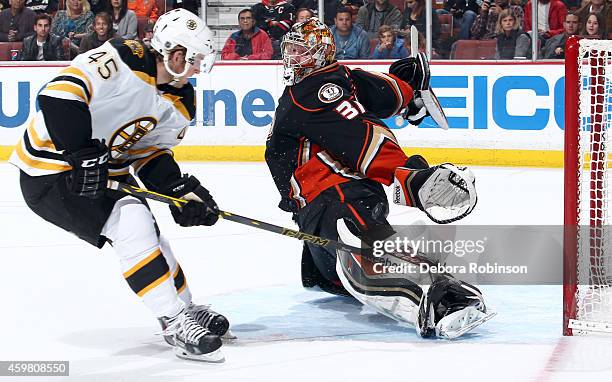 Joe Morrow of the Boston Bruins has his shot stopped by goalie Frederik Andersen of the Anaheim Ducks on December 1, 2014 at Honda Center in Anaheim,...