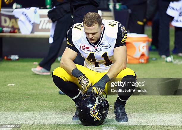 Erik Harris of the Hamilton Tiger-Cats sits dejected after losing the 102nd Grey Cup Championship Game against the Calgary Stampeders at BC Place...