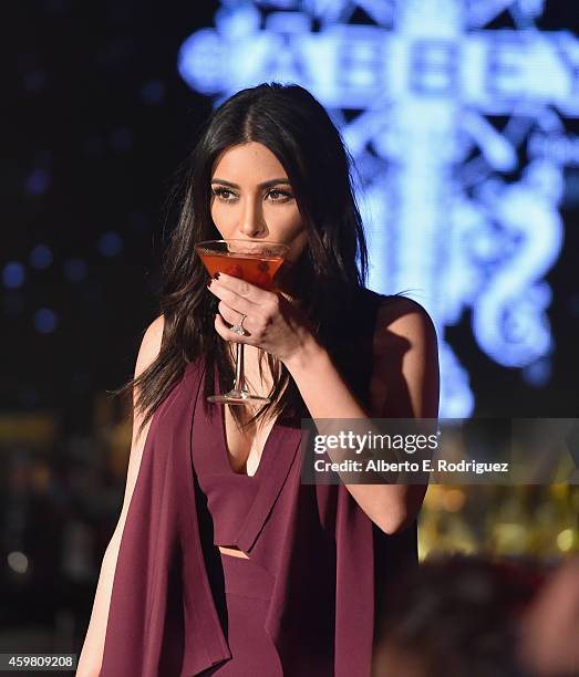 Personality Kim Kardashian raises a toast for the Elizabeth Taylor AIDS Foundation and World AIDS Day at The Abbey on December 1, 2014 in West...