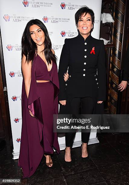 Personalities Kim Kardashian and Kris Jenner raise a toast for the Elizabeth Taylor AIDS Foundation and World AIDS Day at The Abbey on December 1,...