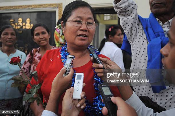 Political activist Naw Ohn Hla speaks to members of the media after she was released from Insein prison, in front of the prison in Yangon on December...