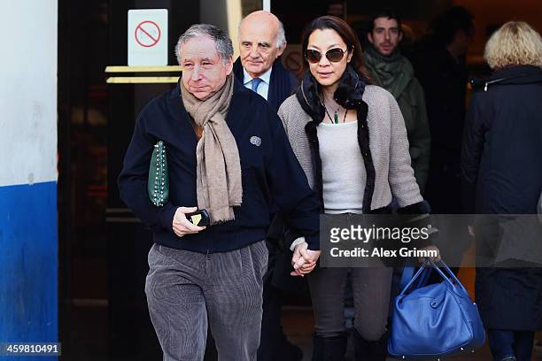 President Jean Todt, his wife actress Michelle Yeoh and surgeon and Michael Schumacher's friend professor Gerard Saillant leave the Grenoble...