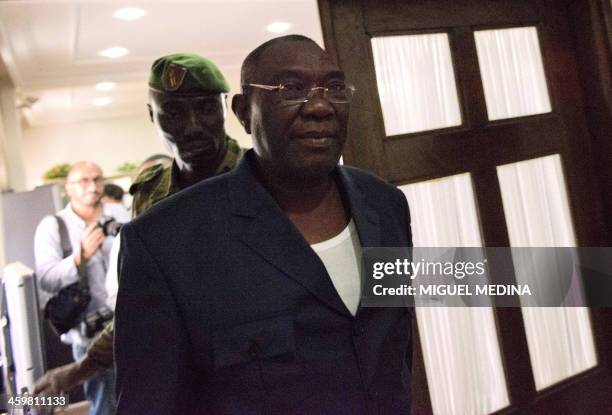 Central African president Michel Djotodia leaves after giving a statement to the press at his residence in Bangui on December 31, 2013. Christian...