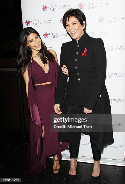 Kim Kardashian and Kris Jenner raise a toast for Elizabeth Taylor Foundation/World AIDS Day held at The Abbey on December 1, 2014 in West Hollywood,...