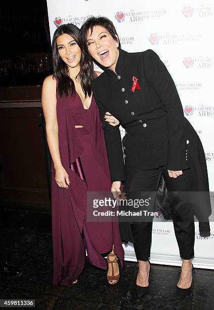 Kim Kardashian and Kris Jenner raise a toast for Elizabeth Taylor Foundation/World AIDS Day held at The Abbey on December 1, 2014 in West Hollywood,...