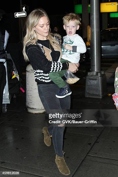 Hilary Duff and Luca Cruz Comrie seen at JFK on December 01, 2014 in New York City.
