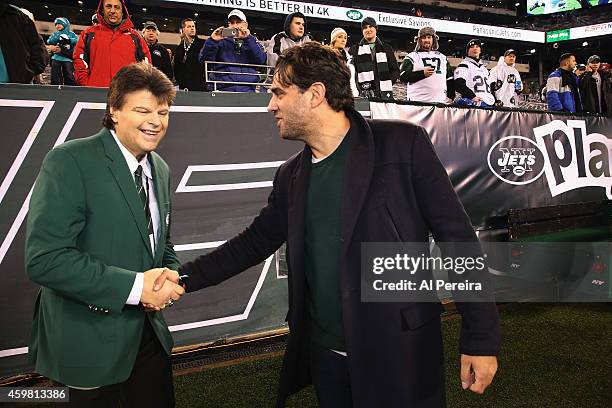 Actor Bobby Cannavale meets with former New York Jets star and Ring of Honor member Mark Gastineau before the New York Jets vs. Miami Dolphins game...