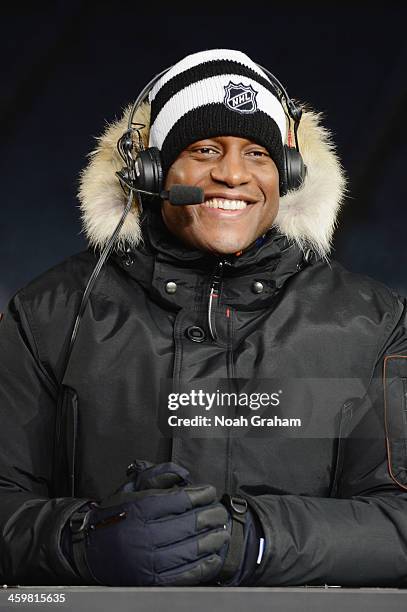 Hockey analyst Kevin Weekes talks with panelists during NHL Live at the 2014 Bridgestone NHL Winter Classic on December 30, 2013 at Michigan Stadium...