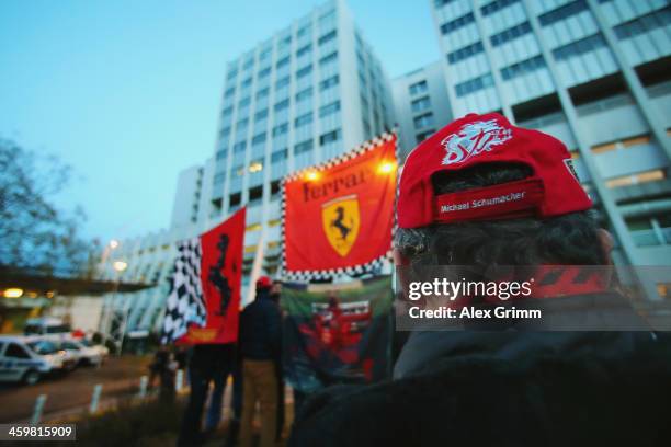 Ferrari fans set up flags outside the Grenoble University Hospital Centre where former German Formula One driver Michael Schumacher is being treated...