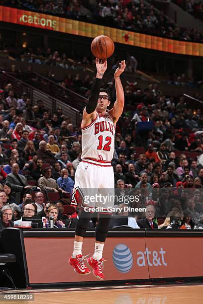 Kirk Hinrich of the Chicago Bulls shoots the ball against the Milwaukee Bucks on December 10, 2013 at the United Center in Chicago, Illinois. NOTE TO...