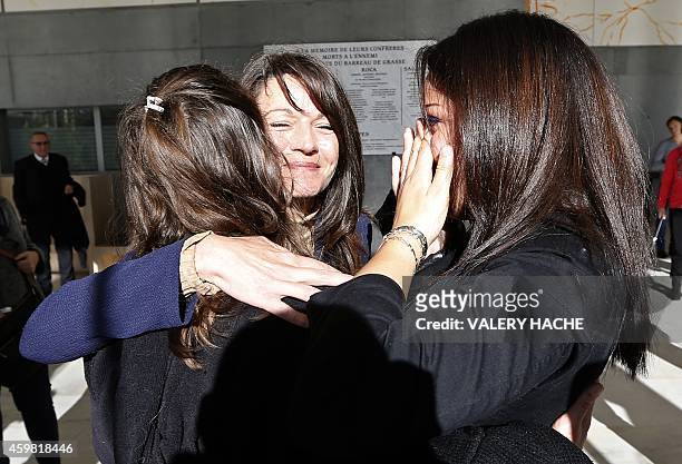 Manon Serrano and her mother Sophie Serrano embrace a relative as they leave Grasse courthouse, on December 2, 2014 at , after a hearing regarding...