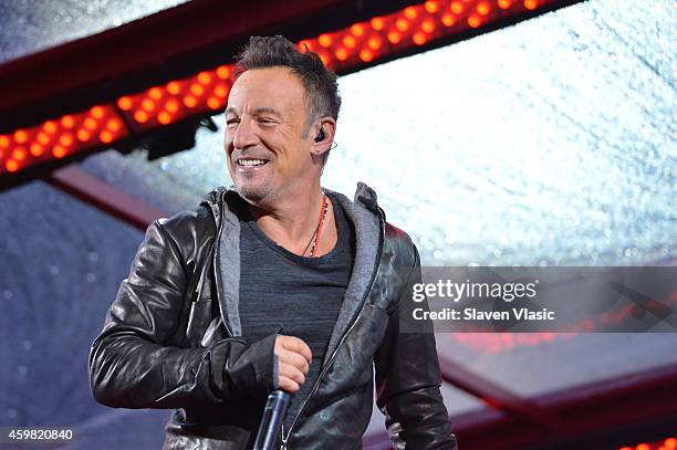 Bruce Springsteen performs on World AIDS Day at 'A Thank You,' presented by RED on December 1, 2014 in New York City.