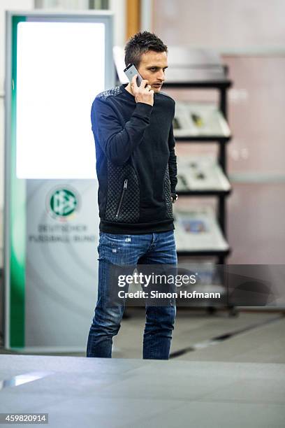 Slawomir Peszko of 1. FC Koeln makes a phone call prior to the decision of DFB Court on the objection to the length of a 3 match ban in the DFB Cup...