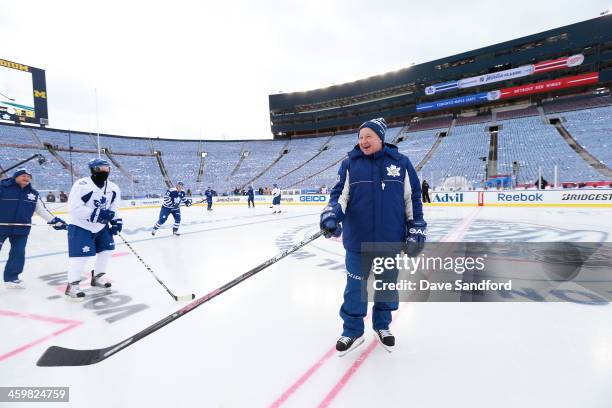 Head Coach Randy Carlyle of the Toronto Maple Leafs takes the ice during 2014 Bridgestone NHL Winter Classic team practice session on December 31,...