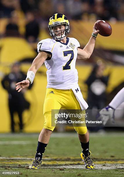Quarterback Shane Morris of the Michigan Wolverines drops back to pass during the Buffalo Wild Wings Bowl against the Kansas State Wildcats at Sun...