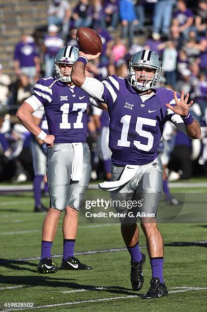 Quarterback Jake Waters of the Kansas State Wildcats throws a pass during pre-game warm up before a game against the Kansas Jayhawks on November 29,...