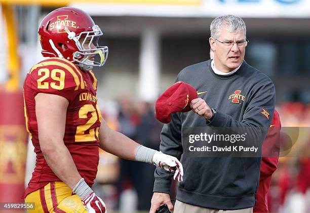 Head coach Paul Rhoads of the Iowa State Cyclones argues a call from the sidelines as linebacker Kane Seeley of the Iowa State Cyclones watches on in...