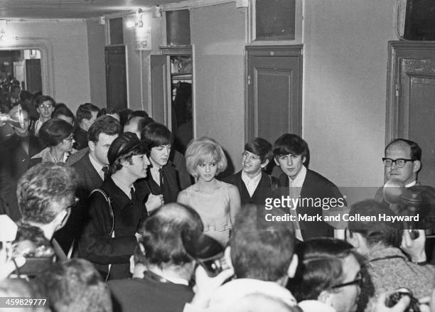16th JANUARY: John Lennon , Paul McCartney, Ringo Starr and George Harrison from the Beatles pose with French singer Sylvie Vartan at Olympia in...