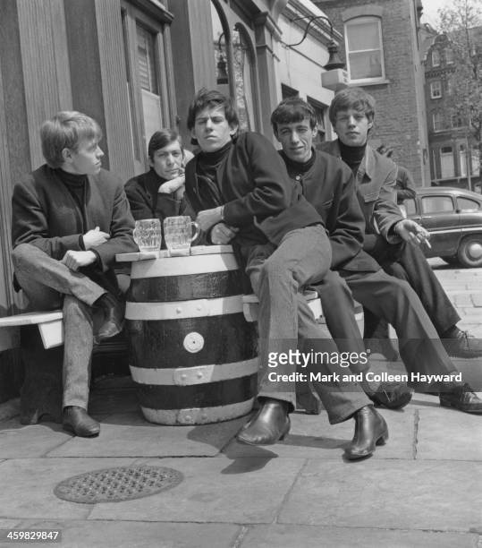 English rock and roll group The Rolling Stones posed outside a London pub circa 1963. From left to right; Brian Jones , Charlie Watts, Keith...
