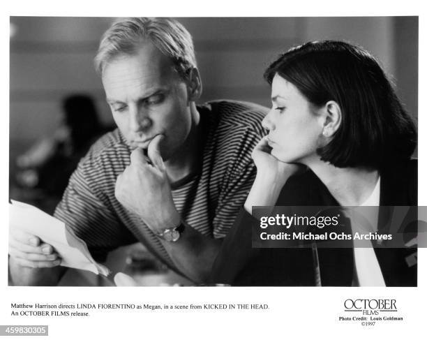 Director Matthew Harrison and actress Linda Fiorentino on set of the movie "Kicked in the Head " , circa 1997.