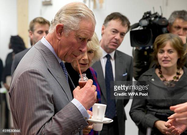 Prince Charles, Prince of Wales takes a sip of an Acai palm berry smoothie drink during a visit to Sky on December 2, 2014 in London, England.